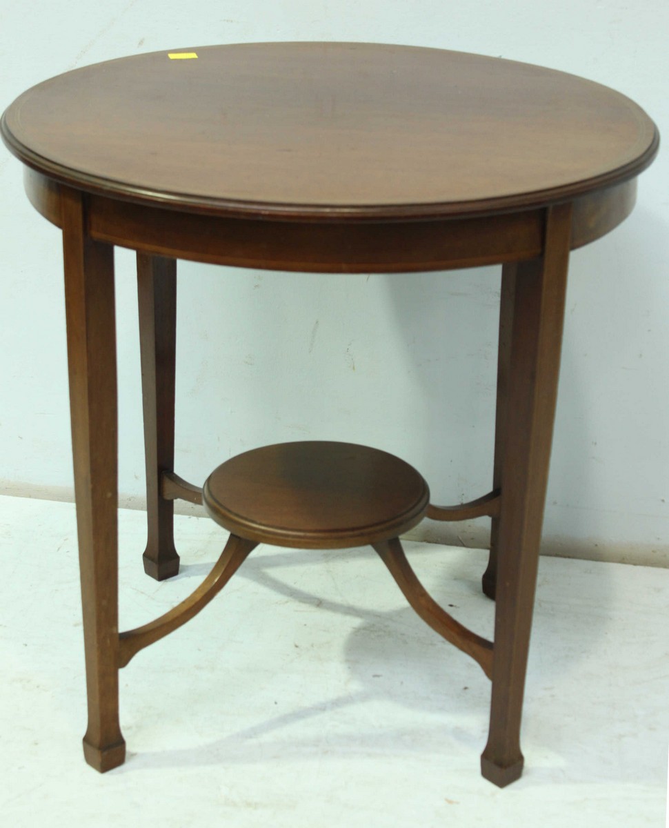 An Edwardian mahogany occasional table, the plain circular top, supported on square tapering legs