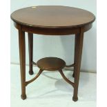 An Edwardian mahogany occasional table, the plain circular top, supported on square tapering legs