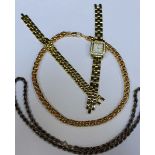 A gold plated ladies watch and bracelet, a silver rope twist chain and a gold plated chain.