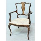 An Edwardian mahogany carver chair, the back splat inlaid with arabesques and bell flowers,