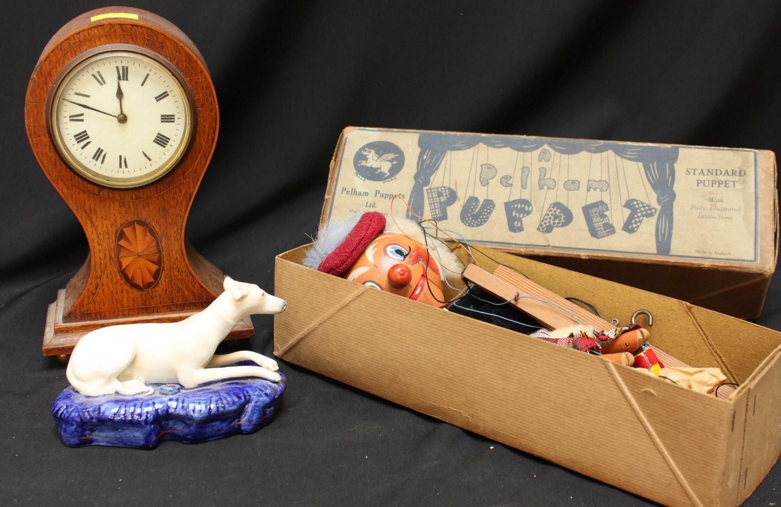 A Pelham Puppets highland dancer, together with a small Edwardian oak mantle clock and a