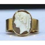 A 15ct gold scarf clip with cameo, weighing approx. 10.7grms.