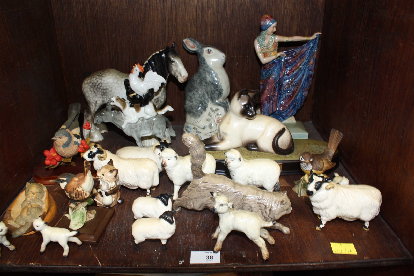 SECTION 38. A collection of twenty-two Beswick sheep, a Doulton cat and other items.
Condition: