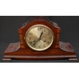 An Edwardian mahogany inlaid mantle clock.