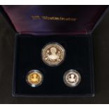 A Queen Mother 95th Birthday commemorative coin set, including a silver £5 and £1 coin and a gold £