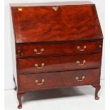 A 19th Century mahogany bureau with a fall front opening to reveal a fitted interior with