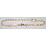 A double row of graduated cultured pearls with 9ct gold clasp, in original box with certificate from