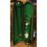 A Corton brass trombone in a fitted case.