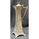 A WMF lidded ewer in and Art Nouveau style, with stylized whiplash foliate decoration, mark to base,