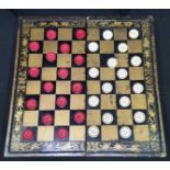 A late 19th/ early 20th century Chinese folding gilt lacquer draughts and backgammon board with 32