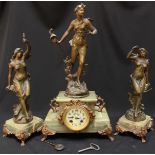 A French onyx and spelter figural clock garniture, formed as a classical lady stood atop an onyx