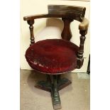 A Victorian mahogany ships tub chair, with padded seat and turned arms, supported on a heavy cast