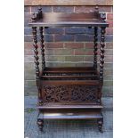 A Victorian rosewood Canterbury whatnot, the galleried top with turned spindles over a two