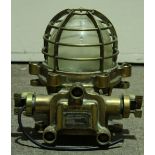 An American ships brass 'Explosion Proof Ceiling Lamp', with brass cage around the light, made by