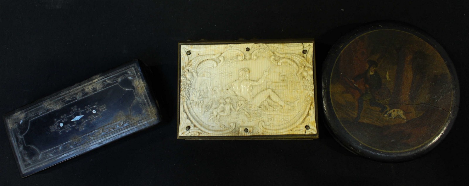 A 19th century brass snuff box, modeled as a book, the top mounted with an applied carved ivory