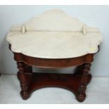 A Victorian mahogany and marble topped wash stand, the serpentine white marble galleried top