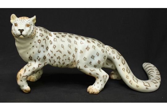 A modern Herend porcelain figure of a snow leopard, hand painted matt finish, signed "Stupian