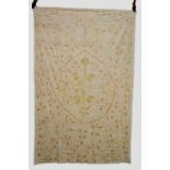 Linen bedcover embroidered in couched floss silk with floral motifs in pastel colours, the central