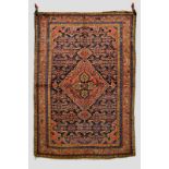Kurdish rug, north west Persia, about 1930s, 7ft. x 4ft. 10in. 2.13m. x 1.47m. Slight loss to top