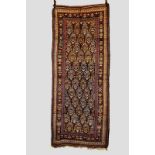 Kurdish long rug, north west Persia, about 1930s, 8ft. 1in. x 3ft. 4in. 2.46m. x 1.02m.