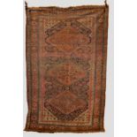 Group of four rugs comprising two Fars rugs, south west Persia, the largest early 20th century, 9ft.