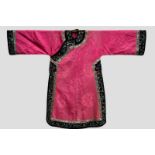 Chinese informal robe of pink silk damask, the collar, facings, hem and cuffs of black satin