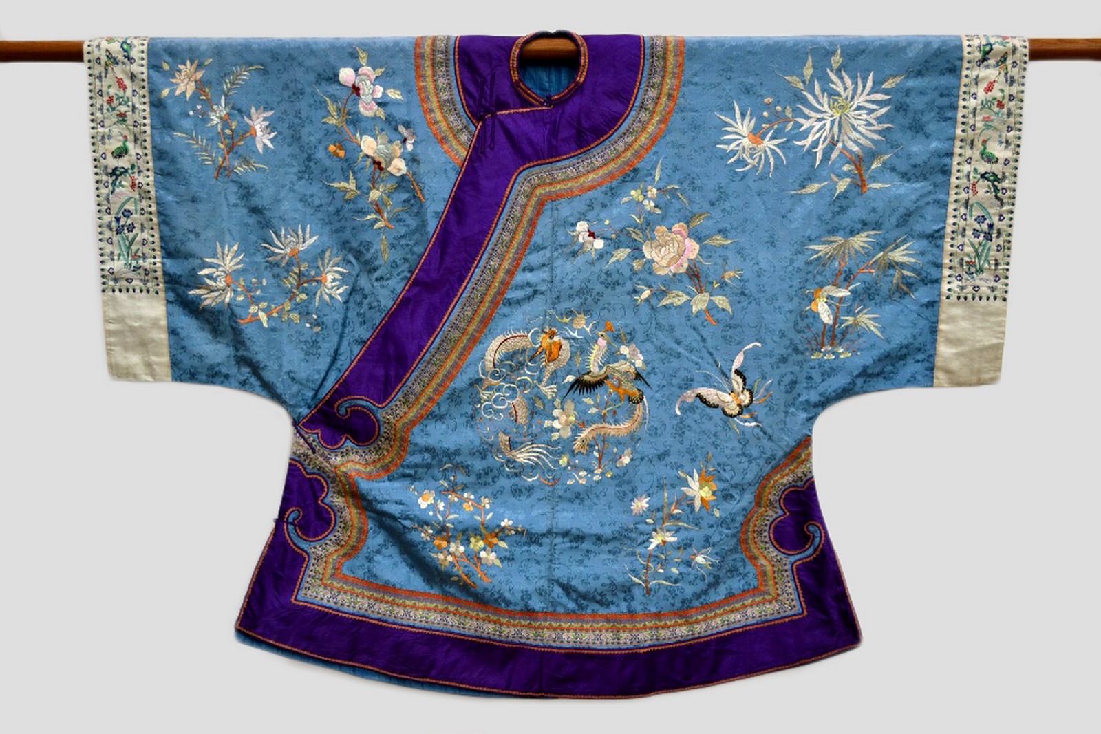 Attractive Chinese woman’s informal robe (ch’i-fu) pale blue silk damask embroidered in coloured