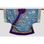 Attractive Chinese woman’s informal robe (ch’i-fu) pale blue silk damask embroidered in coloured