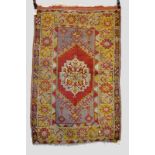 Yuruk rug, east Anatolia, early 20th century, 5ft. 6in. x 3ft. 7in. 1.68m. x 1.09m. Overall wear;