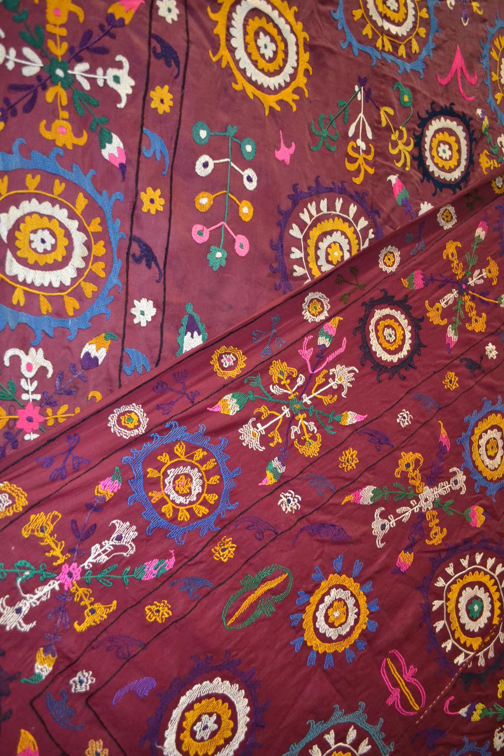 Uzbek suzani, deep plum cotton ground embroidered in bright silks with all over design worked - Image 7 of 8