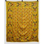 Uzbek suzani embroidered principally in silk basma stitch on a deep yellow satin ground,