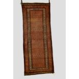 Seraband long rug, north west Persia, circa 1920, 9ft. x 3ft. 6in. 2.75m. x 1.07m. Overall wear with