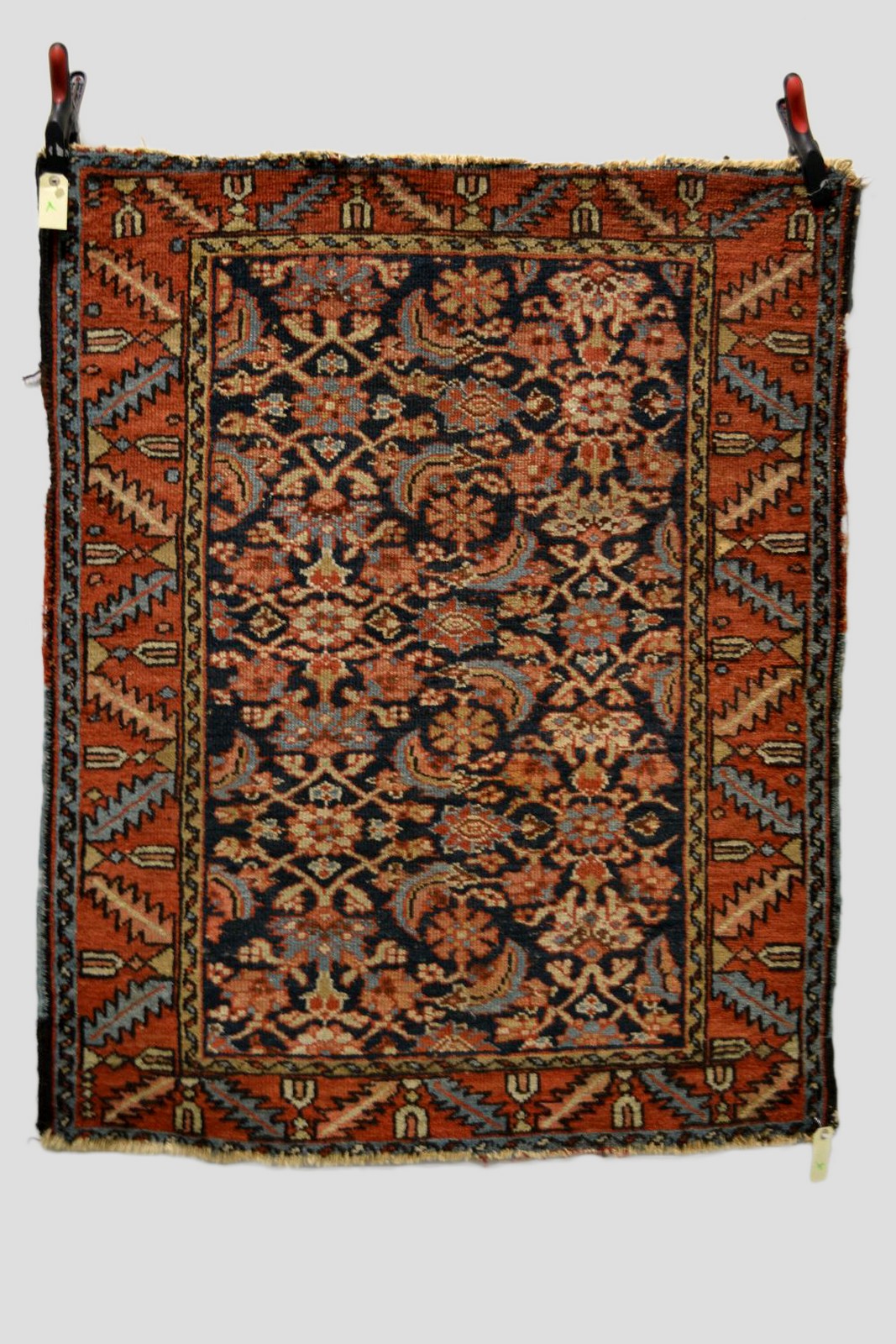 Heriz rug, north west Persia, circa 1920s, 4ft. 2in. x 3ft. 5in. 1.27m. x 1.04m. Overall wear;