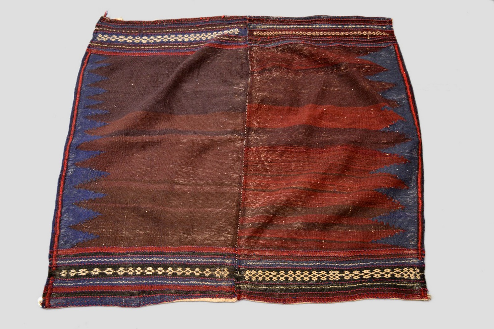 Five weavings comprising: Afshar sofreh; north west Persian banded flatweave; Baluchi khorjin