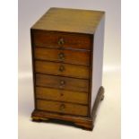 A late eighteenth century small mahogany nest of drawers table cabinet, of six oak lined drawers