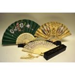 A late nineteenth century Chinese ivory and painted muslin silk fan, with a black and gold lacquer
