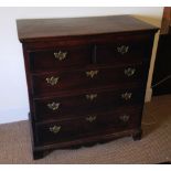 An eighteenth century oak chest, of North Country origin, the two short and three long drawers, with