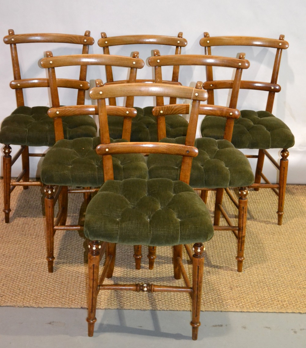 A set of six late nineteenth century beech side chairs, in rustic style with ivory buttons to the