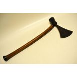 A Zulu axe, with patterned iron head, the wood handle, later painted. 20in (51cm) late nineteenth