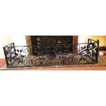 A wrought iron pierced fender, with scrolling foliage and centred a flowerhead. 4ft 4in wide x 15.