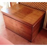 An early nineteenth century mahogany blanket box, with a hinged lid, the plinth base on short