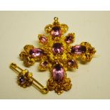 Victorian gold brooch/pendant having 9 foiled pink topaz in a cannetille style setting, approx 6.8cm
