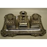 A late Victorian silver rectangular partners inkstand, in Regency style, having a gadroon border