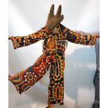 Nigerian ceremonial cotton and felt appliqué patchwork child's dance costume, with carved wood