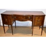 A mahogany sideboard, in Sheraton Revival style, inlaid stringing and cross banded, fitted a central