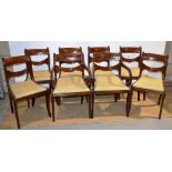 A set of eight nineteenth century mahogany dining chairs, the swagged and panelled crested backs, to