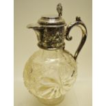 A late Victorian cut and moulded moon flask design glass claret jug, the sides with a catherine