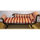 A Regency chaise longue, the grained beech show frame with striped upholstery, a squat cushion