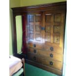 A Liberty & Co ash compactum wardrobe, with a moulded cornice, a full length hanging compartment