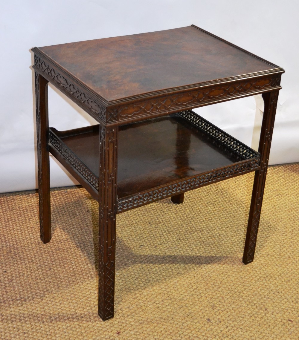 A George III mahogany bedside table, with Chippendale style blind fretwork and a pierced fretwork